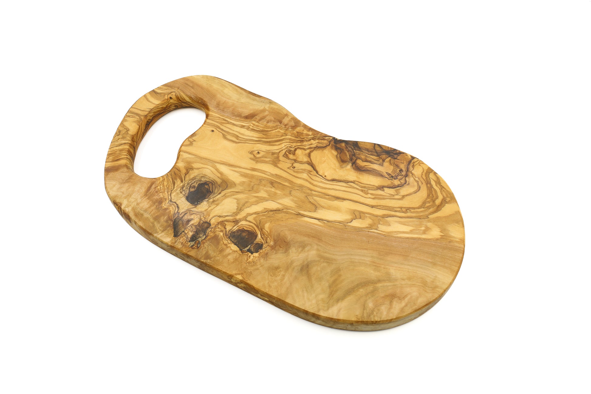Olive wood cutting board featuring a natural in-hand handle