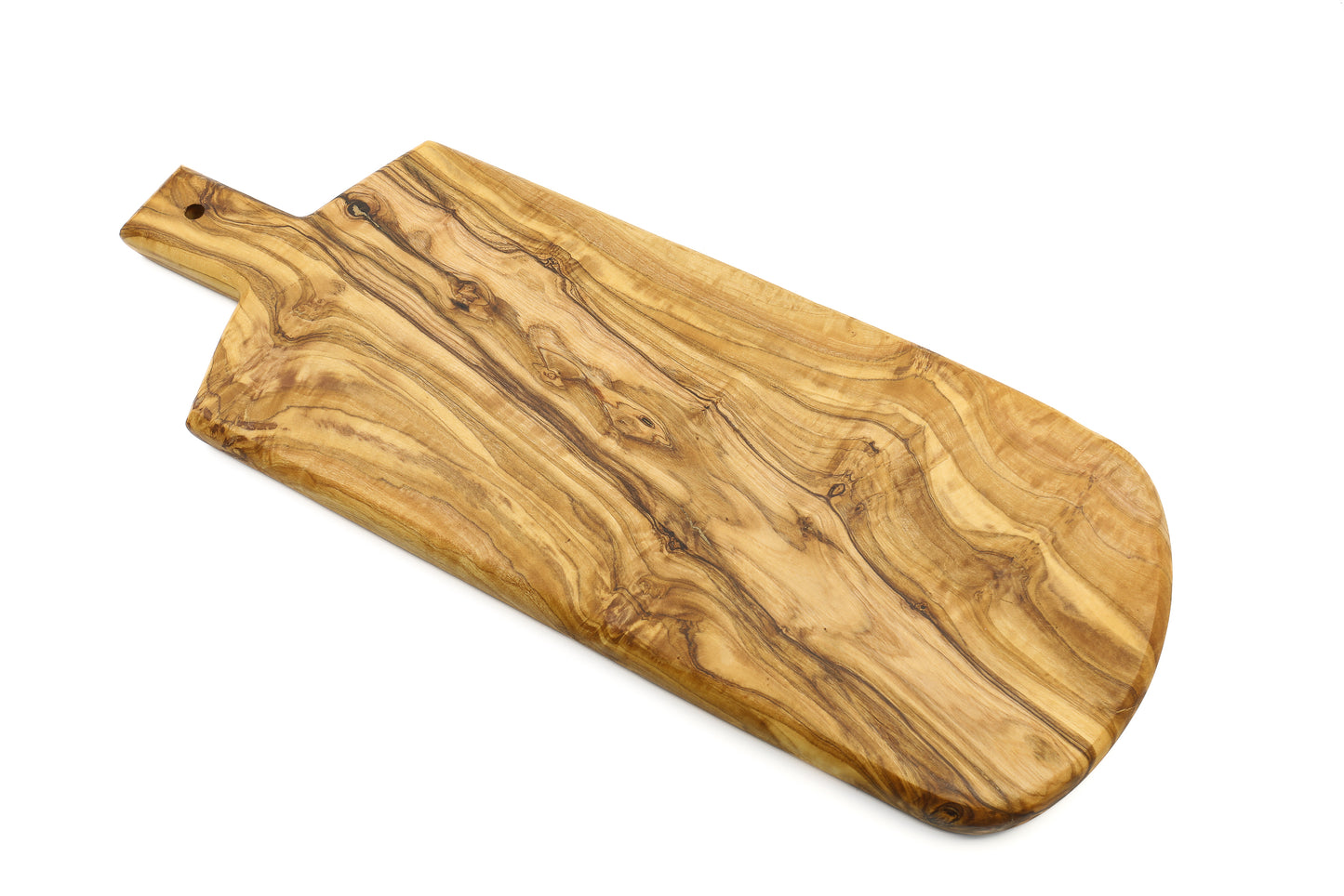 A serving board crafted from olive wood in a shield shape, complete with a handle