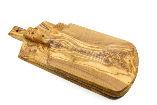 Serving board made of olive wood in a shield shape with a handle
