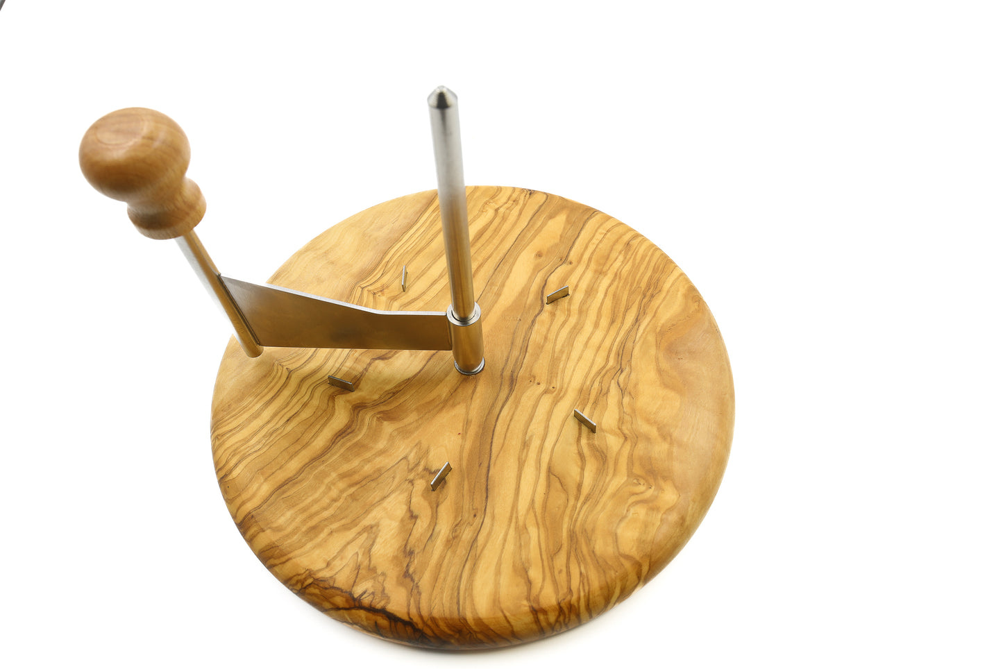 Elegant cheese presentation with an olive wood cheese board, stainless steel platter, and cheese shaver