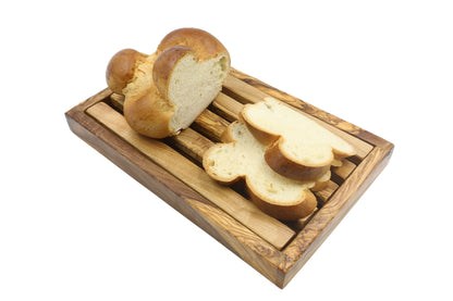Artisan-made wooden bread cutting board in beautiful olive wood with a built-in crumb catcher