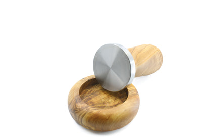 Artisan-made olive wood and stainless steel tamper for a perfect coffee experience