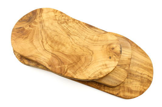 Handcrafted olive wood cutting board with an irregular, organic shape