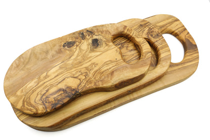 In-hand olive wood cutting board with a unique organic design