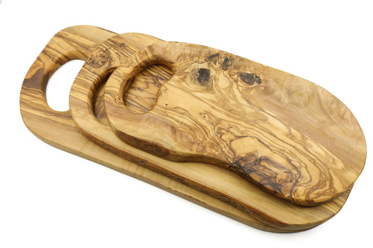 Organic-shaped olive wood cutting board with in-hand grip