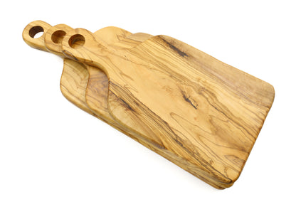 Handcrafted olive wood paddle-shaped chopping board with a handle