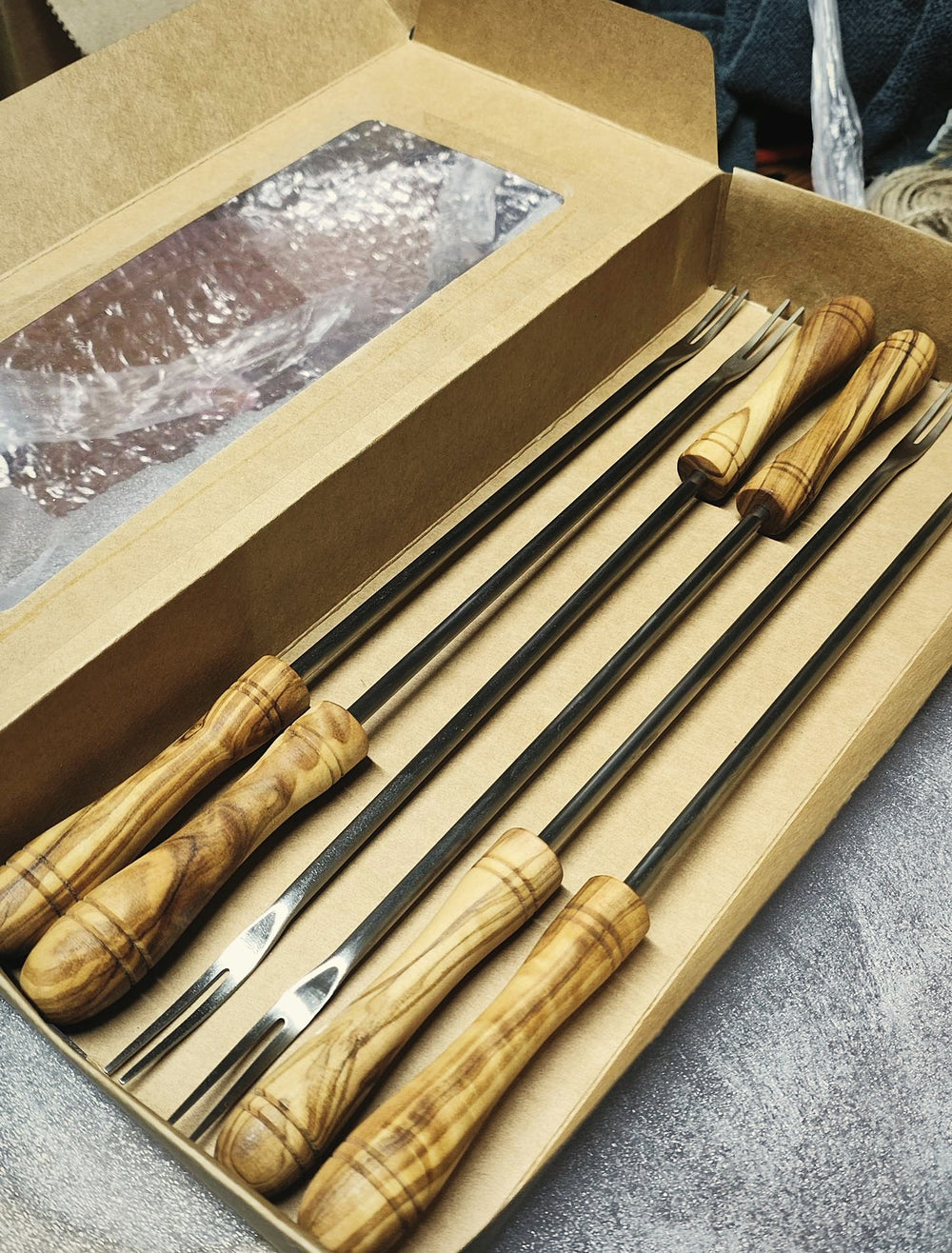 Set of six olive wood fondue forks in a gift box
