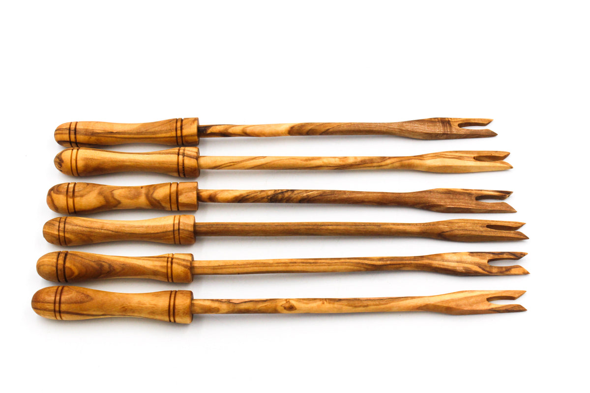 Close-up of the olive wood fondue forks